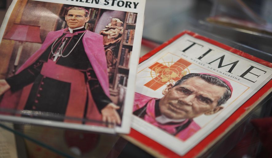 Artifacts and memorabilia depicting the late Archbishop Fulton Sheen are displayed in the Sheen Museum on July 15, 2026, in Peoria, Ill. (AP Photo/Jessie Wardarski)