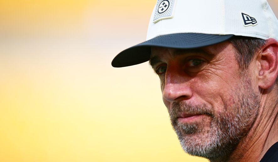 Pittsburgh Steelers quarterback Aaron Rodgers watches warmups before a preseason NFL football game against the Green Bay Packers in Pittsburgh, Thursday, Aug. 13, 2026. (AP Photo/David Dermer)