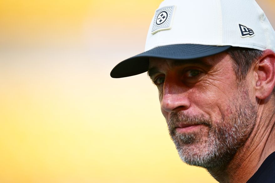 Pittsburgh Steelers quarterback Aaron Rodgers watches warmups before a preseason NFL football game against the Green Bay Packers in Pittsburgh, Thursday, Aug. 13, 2026. (AP Photo/David Dermer)