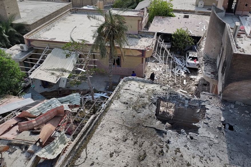 An aerial view shows the apparent point of impact on the roof of a building that Iranian media said was hit by a U.S. strike while a wedding celebration was taking place there, in Kuhestak, southern Iran, Wednesday, Sept. 2, 2026. (Morteza Akhoondi/Tasnim News Agency via AP)