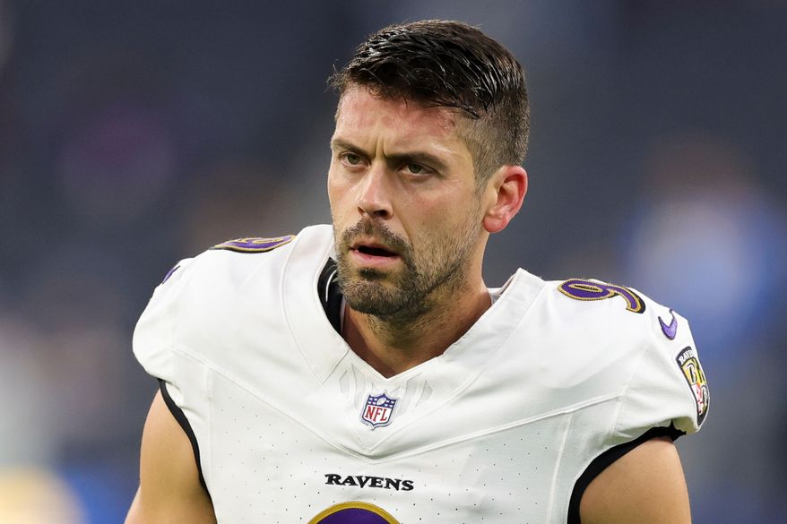 FILE - Baltimore Ravens place kicker Justin Tucker (9) walk on the field before an NFL football game against the Los Angeles Chargers, Nov. 25, 2024, in Inglewood, Calif. (AP Photo/Ryan Sun, FIle)