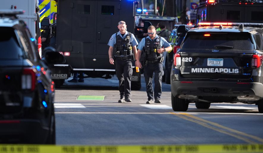 Police respond to a shooting Wednesday, Sept. 2, 2026, in downtown Minneapolis. (AP Photo/Ellen Schmidt)