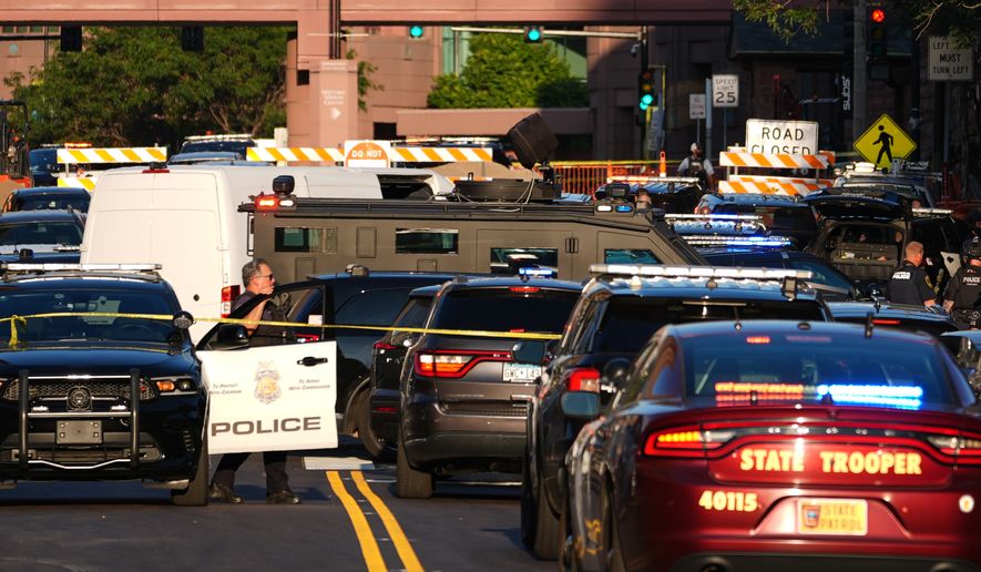 Law enforcement respond to a shooting Wednesday, Sept. 2, 2026, in downtown Minneapolis. (AP Photo/Ellen Schmidt)