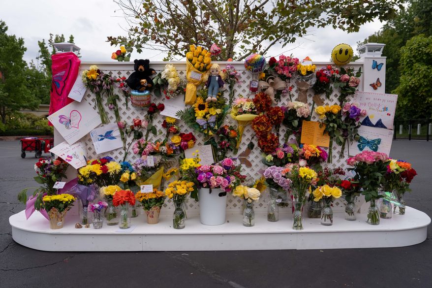 A memorial wall for Dolly Parton stands outside the Dollywood theme park in Pigeon Forge, Tenn., Wednesday, Aug. 26, 2026. (AP Photo/Camden Hall)