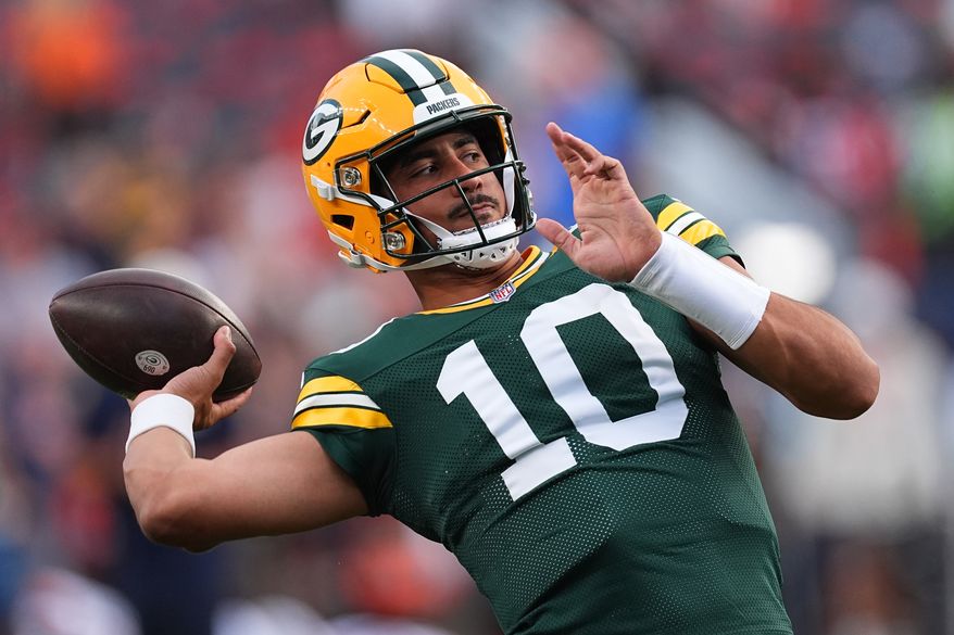 Green Bay Packers quarterback Jordan Love (10) warms up before an NFL preseason football game against the Denver Broncos, Friday, Aug. 21, 2026, in Denver. (AP Photo/David Zalubowski)