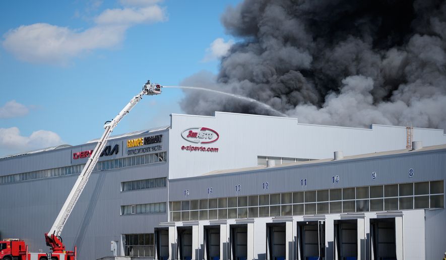 Firefighters put out a fire at warehouse stores after a Russian air attack in Kyiv, Ukraine, Wednesday, Sept. 2, 2026. (AP Photo/Efrem Lukatsky)