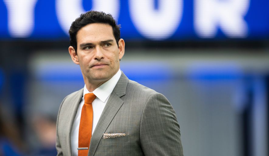 Mark Sanchez walks on the field before an NFL football game between the Los Angeles Rams and the Jacksonville Jaguars Sunday, Dec. 5, 2021, in Inglewood, Calif. (AP Photo/Kyusung Gong, File)
