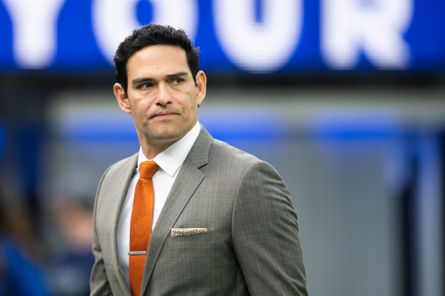 Mark Sanchez walks on the field before an NFL football game between the Los Angeles Rams and the Jacksonville Jaguars Sunday, Dec. 5, 2021, in Inglewood, Calif. (AP Photo/Kyusung Gong, File)
