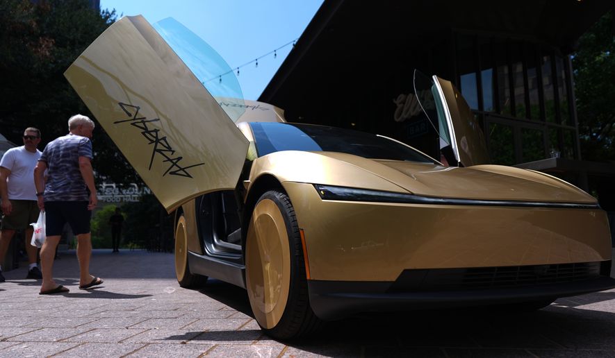 A Tesla Cybercab is displayed in downtown Austin, Texas, Thursday, Sept. 3, 2026. (AP Photo/Eric Gay)