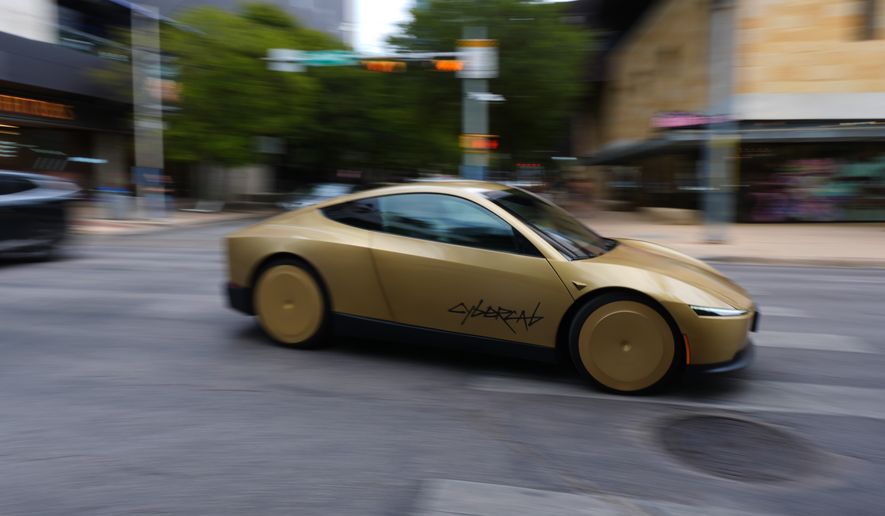 A Tesla Cybercab moves through downtown Austin, Texas, Thursday, Sept. 3, 2026. (AP Photo/Eric Gay)