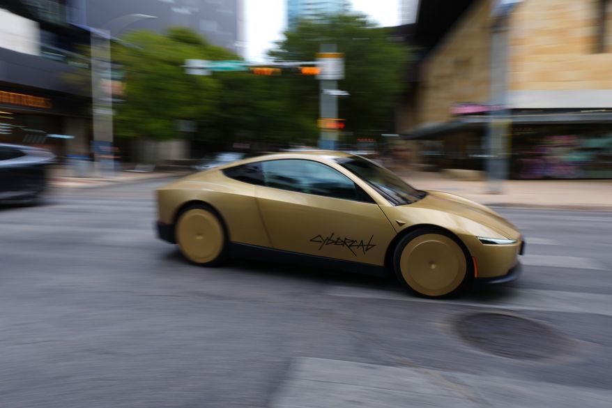 A Tesla Cybercab moves through downtown Austin, Texas, Thursday, Sept. 3, 2026. (AP Photo/Eric Gay)