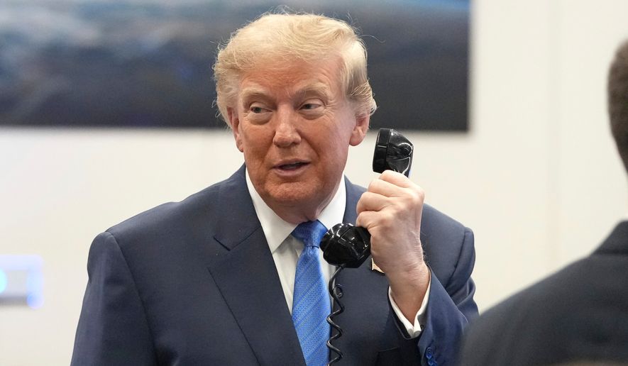 President Donald Trump speaks to astronauts aboard the International Space Station, Friday, Aug. 28, 2026, at Johnson Space Center's Mission Control Center in Houston. (AP Photo/Mark Schiefelbein)