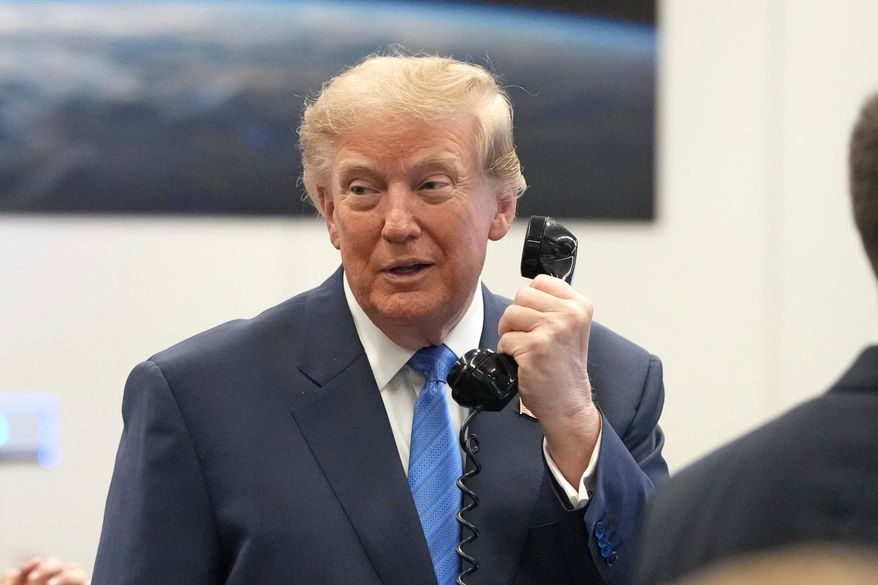 President Donald Trump speaks to astronauts aboard the International Space Station, Friday, Aug. 28, 2026, at Johnson Space Center's Mission Control Center in Houston. (AP Photo/Mark Schiefelbein)