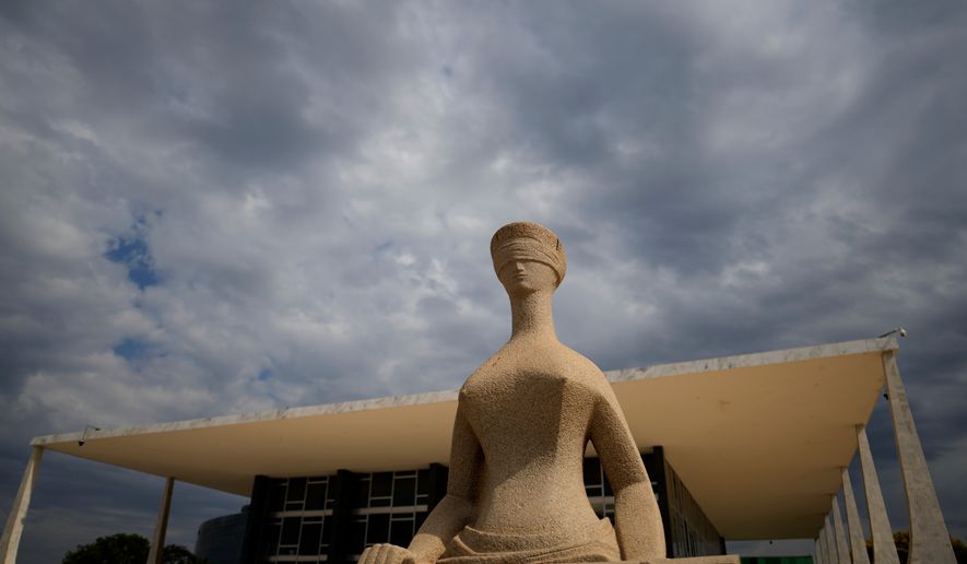 The Statue of Justice stands outside the Supreme Court building ahead of a plenary session in Brasilia, Brazil, Wednesday, Sept. 2, 2026. (AP Photo/Eraldo Peres)