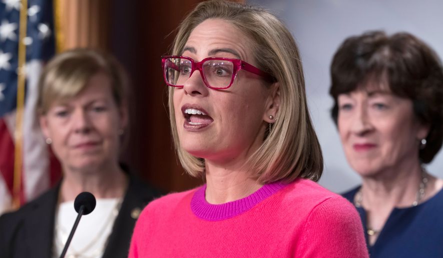 Sen. Kyrsten Sinema, D-Ariz., speaks to reporters following Senate passage of the Respect for Marriage Act, at the Capitol in Washington, Nov. 29, 2022. (AP Photo/J. Scott Applewhite, File)