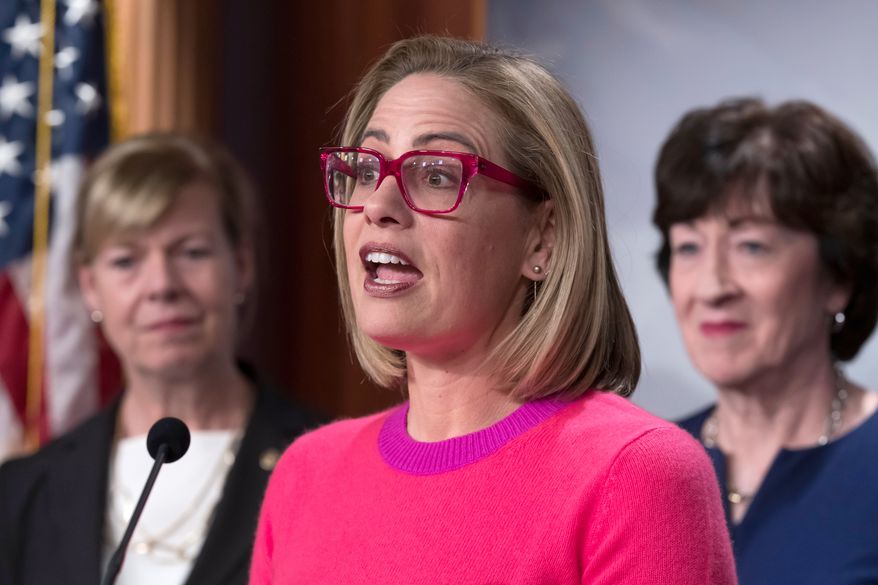 Sen. Kyrsten Sinema, D-Ariz., speaks to reporters following Senate passage of the Respect for Marriage Act, at the Capitol in Washington, Nov. 29, 2022. (AP Photo/J. Scott Applewhite, File)