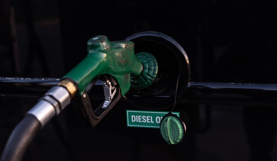 A nozzle pumps diesel into the fuel tank of a bus in Orange, Calif., Tuesday, April 7, 2026. (AP Photo/Jae C. Hong, File)