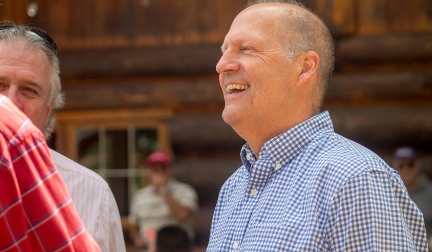 Former Sen. John E. Sununu, who is running for his old seat nearly 18 years after being ousted, mingles with voters at the Coos County Republican Committee BBQ in Berlin, N.H., Saturday, Aug. 22, 2026. (AP Photo/Holly Ramer)