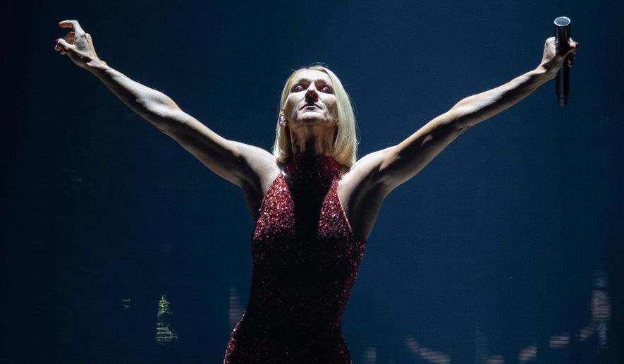FILE - Singer Celine Dion performs during her first World Tour called Courage in Quebec City, Montreal, Canada on Sept. 19, 2019. (Jacques Boissinot/The Canadian Press via AP, File)