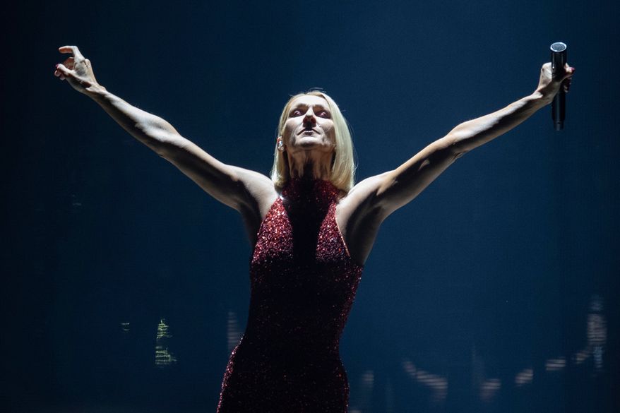 FILE - Singer Celine Dion performs during her first World Tour called Courage in Quebec City, Montreal, Canada on Sept. 19, 2019. (Jacques Boissinot/The Canadian Press via AP, File)
