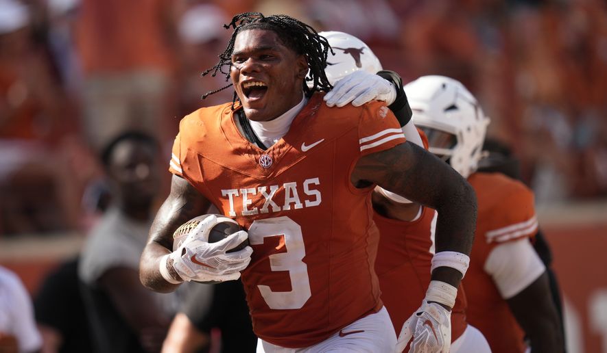 Texas linebacker Rasheem Biles (3) celebrates an interception against Texas State during the second half of an NCAA college football game in Austin, Texas, Saturday, Sept. 5, 2026. (AP Photo/Eric Gay)