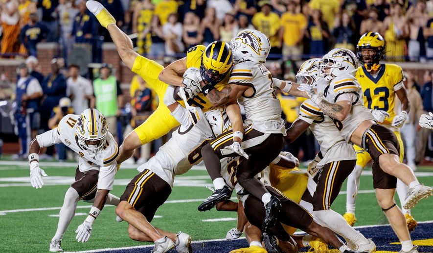 Michigan's wide receiver JJ Buchanan (6) makes the game-winning catch to win over Western Michigan with a last-second touchdown during an NCAA college football game in Ann Arbor, Mich., Saturday, Sept. 5 2026. (Jacob Hamilton/Ann Arbor News via AP)