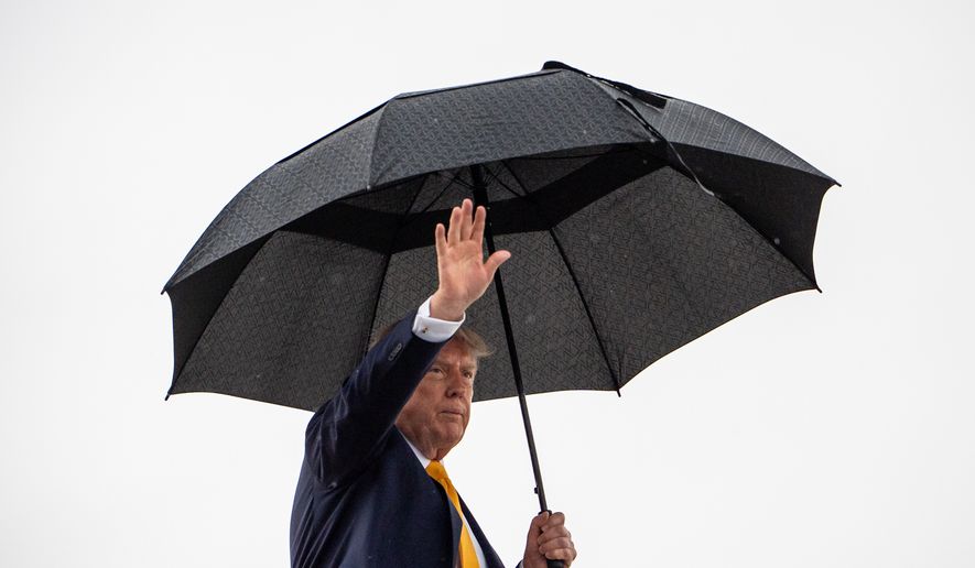 President Donald Trump waves while boarding Air Force One, Friday, Sept. 4, 2026, at Joint Base Andrews, Md. (AP Photo/Julia Demaree Nikhinson)