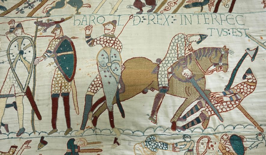 The 70-meter-long Bayeux Tapestry is displayed during a press preview at the British Museum in London after returning to England, following a historic agreement between the UK and France, Monday, Sept. 7, 2026. (AP Photo/Kin Cheung)