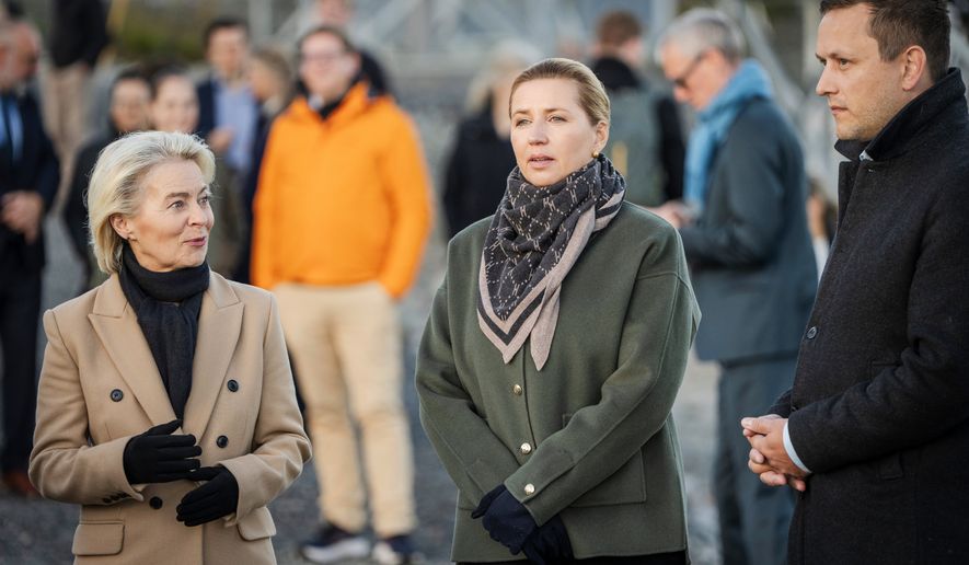 Denmark's Prime Minister Mette Frederiksen, center, President of the European Commission Ursula von der Leyen, left, and Greenland's Prime Minister Jens-Frederik Nielsen, visit the company Eutelsat OneWeb in Nuuk, Greenland, Monday, Sept. 7, 2026. (Mads Claus Rasmussen/Ritzau Scanpix via AP)