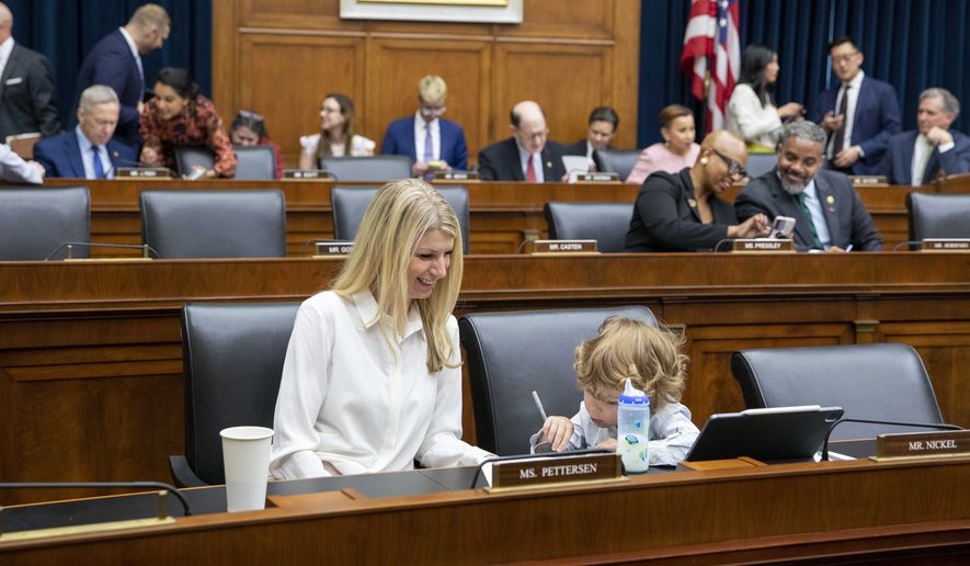 Rep. Brittany Pettersen, D-Colo., and her 3-year-old son Davis Silverii attend the House Financial Services Committee hearing regarding the state of the international financial system at the Capitol in Washington on Tuesday, June 13, 2023. (AP Photo/Amanda Andrade-Rhoades) **FILE**