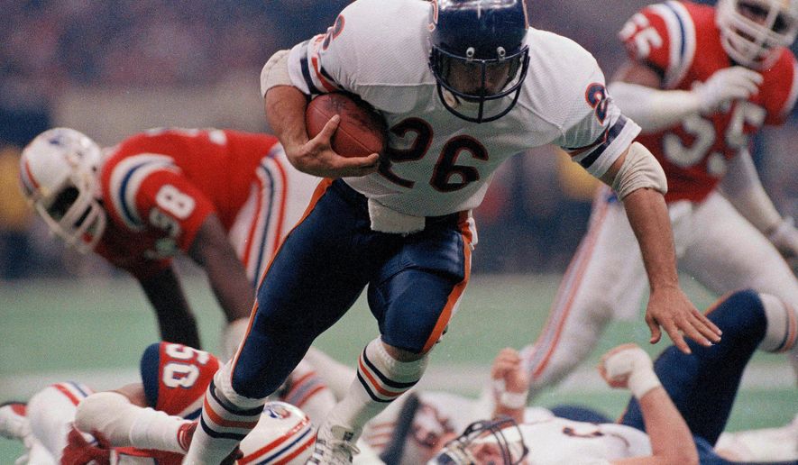 FILE - Chicago Bear's Matt Suhey (26) heads for a touchdown during the NFL Super Bowl 20 football game against the New England Patriots in New Orleans, Jan. 26, 1986. (AP Photo, File)