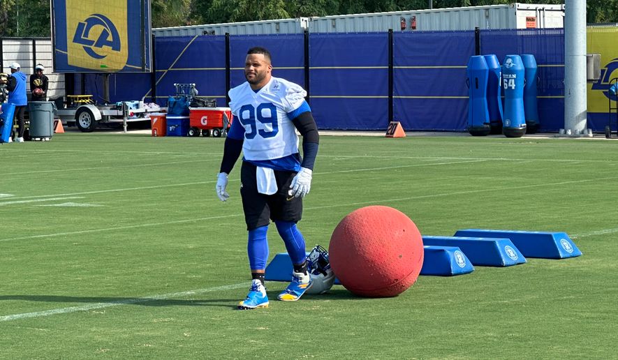 Aaron Donald takes the field for practice at the Los Angeles Rams' training complex in Los Angeles, Sunday, Aug. 30, 2026. (AP Photo/Greg Beacham)