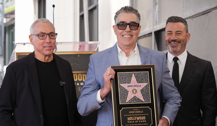 Drew Pinsky, from left, Adam Carolla, and Jimmy Kimmel pose with Carolla's new star during a ceremony on the Hollywood Walk of Fame on Wednesday, May 27, 2026, in Los Angeles. (AP Photo/Chris Pizzello)