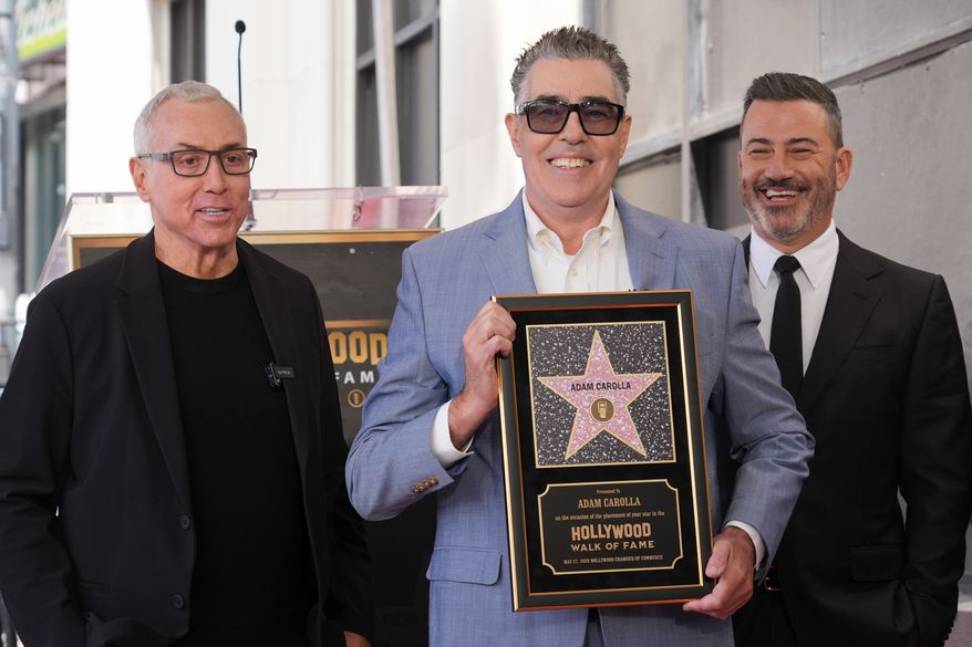 Drew Pinsky, from left, Adam Carolla, and Jimmy Kimmel pose with Carolla's new star during a ceremony on the Hollywood Walk of Fame on Wednesday, May 27, 2026, in Los Angeles. (AP Photo/Chris Pizzello)