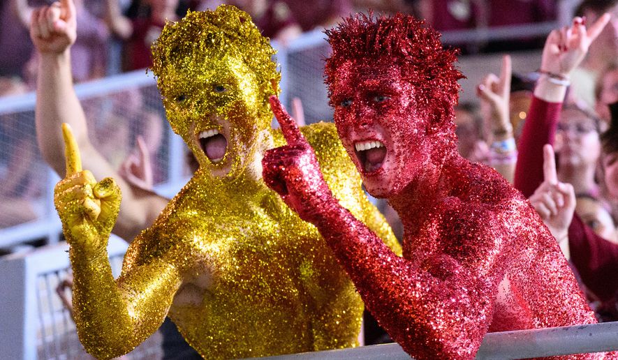 Florida State students react during a stadium-wide power outage before an NCAA college football game against SMU, Monday, Sept. 7, 2026, in Tallahassee, Fla. (AP Photo/Noah Lantor)