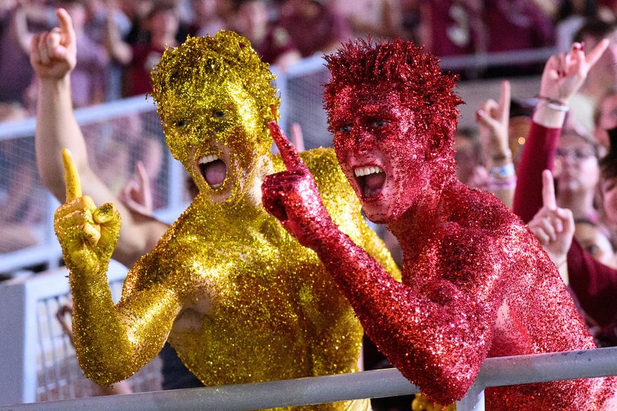 Florida State students react during a stadium-wide power outage before an NCAA college football game against SMU, Monday, Sept. 7, 2026, in Tallahassee, Fla. (AP Photo/Noah Lantor)