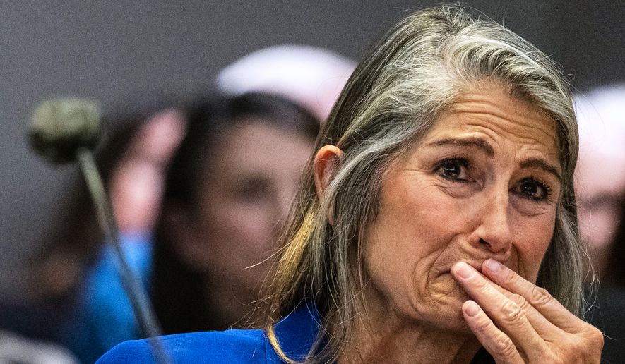Former Colorado Bureau of Investigation forensic analyst Yvonne "Missy" Woods cries as she watches a video during a her sentencing hearing at the Jefferson County Courthouse, Tuesday, Sept. 8, 2026, in Golden, Colo. (Stephen Swofford//The Gazette via AP, Pool