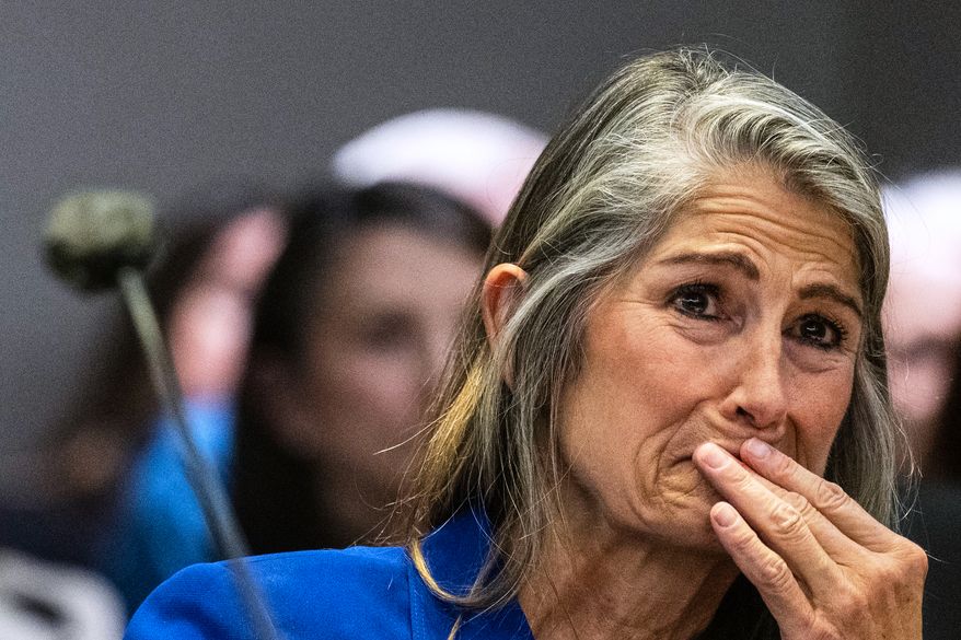 Former Colorado Bureau of Investigation forensic analyst Yvonne "Missy" Woods cries as she watches a video during a her sentencing hearing at the Jefferson County Courthouse, Tuesday, Sept. 8, 2026, in Golden, Colo. (Stephen Swofford//The Gazette via AP, Pool