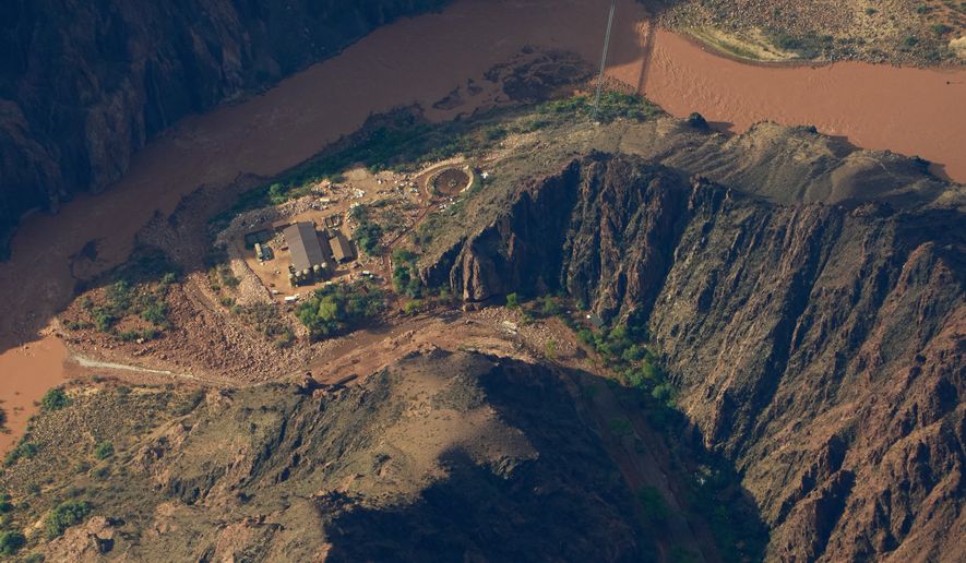 Flood debris lines Bright Angel Canyon near where it meets the Colorado River in the Grand Canyon, Monday, Aug. 31, 2026, at Grand Canyon National Park, Ariz. (AP Photo/John Locher)