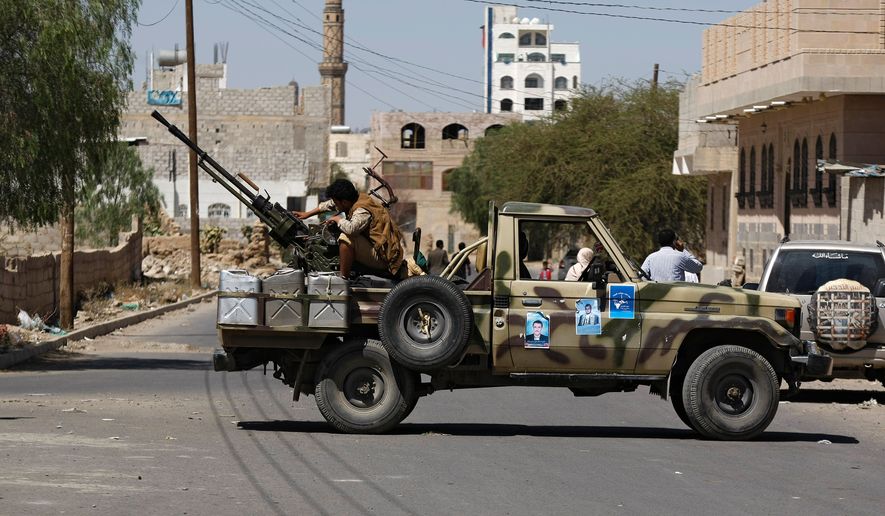 FILE - A Houthi Shiite rebel mans a machine gun mounted on a military truck in Sanaa, Yemen, Monday, Oct. 20, 2014. (AP Photo/Hani Mohammed, File)