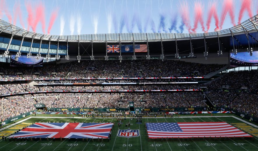 The Union Jack and United States flags are presented on the field during the singing of the national anthem before an NFL football game between the Green Bay Packers and the New York Giants at Tottenham Hotspur Stadium in London, Oct. 9, 2022. (AP Photo/Steve Luciano) **FILE**
