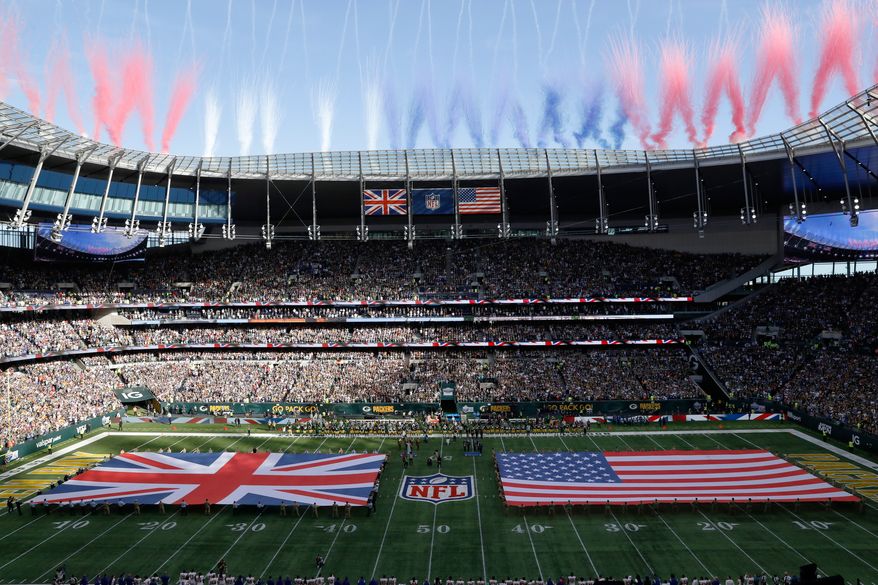 The Union Jack and United States flags are presented on the field during the singing of the national anthem before an NFL football game between the Green Bay Packers and the New York Giants at Tottenham Hotspur Stadium in London, Oct. 9, 2022. (AP Photo/Steve Luciano) **FILE**