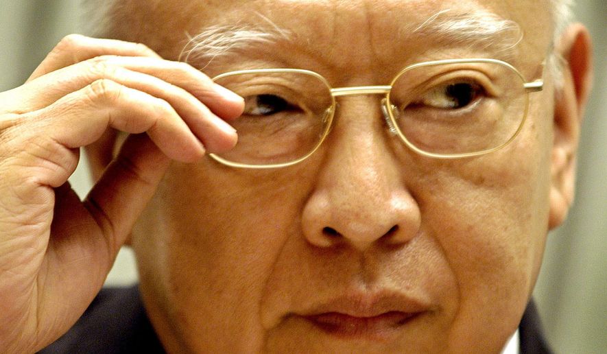 FILE - Hong Kong's Cheif Executive Tung Chee-hwa listens to reporter's question during a news conference at government headquarters in Hong Kong, April 26, 2004. (AP Photo/Vincent Yu, File)