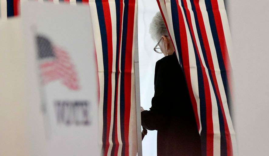 Camille Coulborn of Chesterfield, N.H., fills out her ballot inside a voting booth in Chesterfield during the New Hampshire State Primaries on Tuesday, Sept. 8, 2026. (Kristopher Radder/The Brattleboro Reformer via AP)
