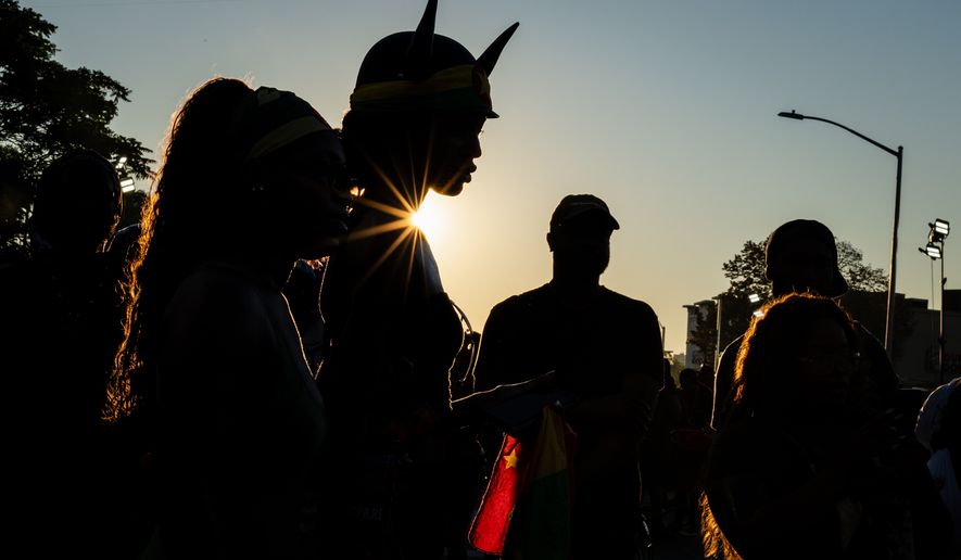 People participate in J'Ouvert festivities ahead of the West Indian Day Parade at sunrise on Labor Day in the Crown Heights and Flatbush neighborhoods of Brooklyn, Monday, Sept. 7, 2026, in New York. (AP Photo/Angelina Katsanis)