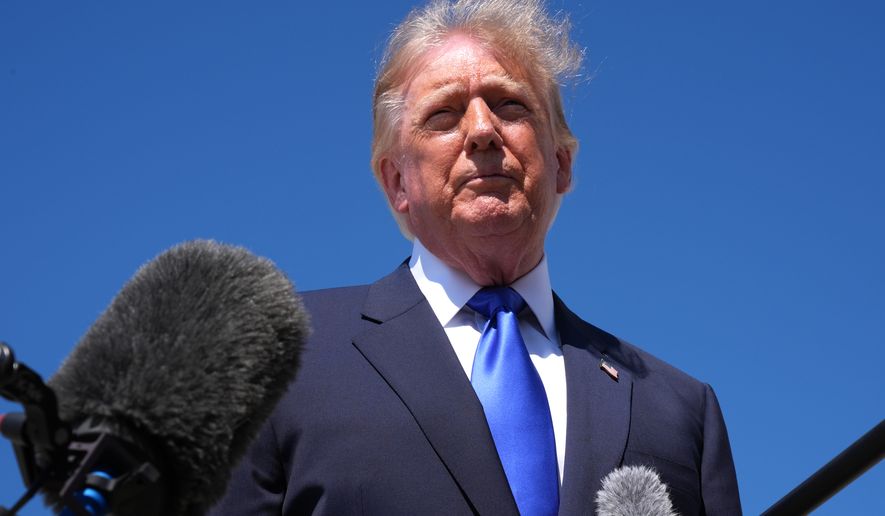 President Donald Trump talks with reporters after an emergency inflatable slide deployed on Air Force One before before Trump arrived to board at Joint Base Andrews, Md., Wednesday, Sept. 9, 2026. (AP Photo/Jacquelyn Martin)
