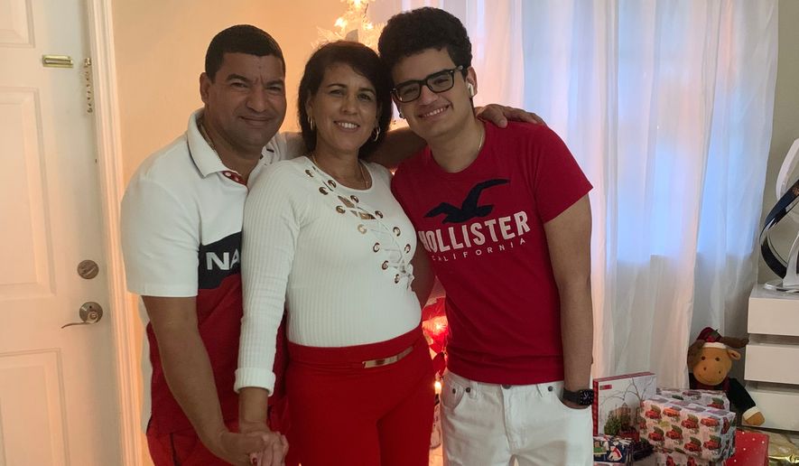 This undated photo provided by the family of Yoel Rodriguez Naranjo via Morgan & Morgan on Wednesday, Sept. 9, 2026, shows Naranjo, left, with his wife and son. (Family/Morgan & Morgan via AP)