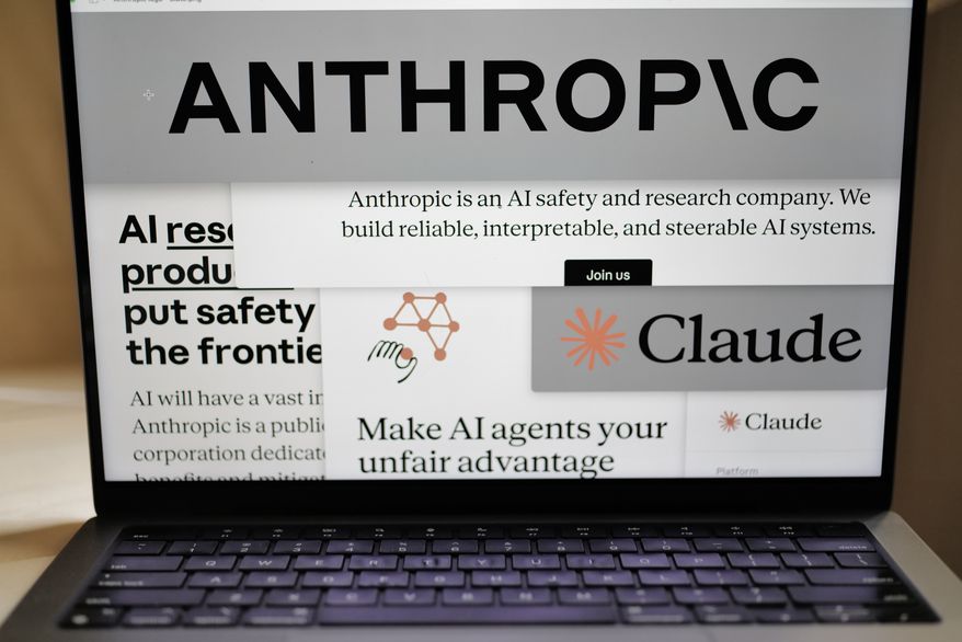 Pages from the Anthropic website and the company's logos are displayed on a computer screen in New York, Feb. 26, 2026. (AP Photo/Patrick Sison, File)