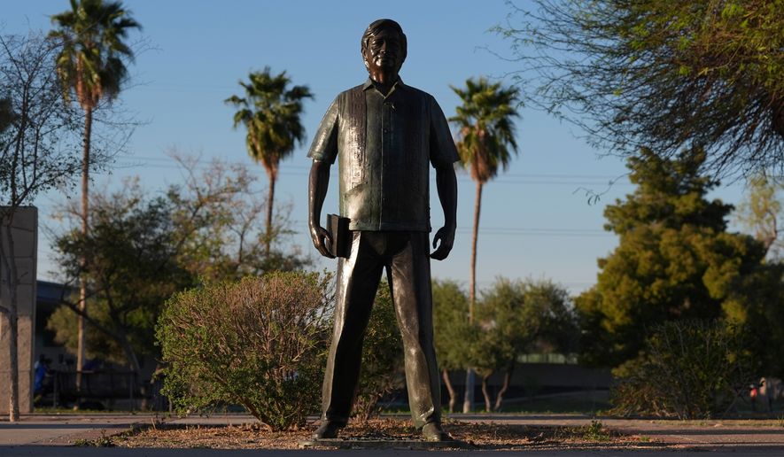 A statute of César Chavez stands in the middle of a plaza at Cesar Chavez Park, honoring the United Farm Workers union founder, March 18, 2026, in Laveen, Ariz. (AP Photo/Ross D. Franklin, File)