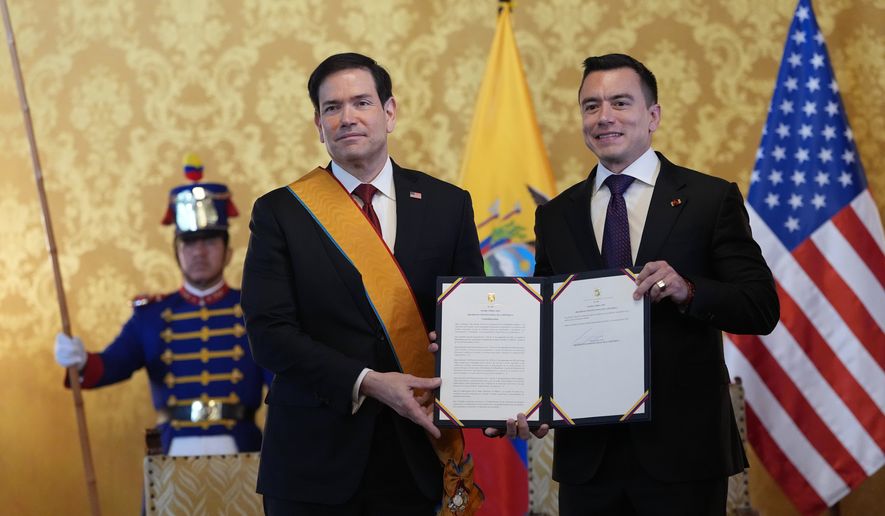 Ecuador's President Daniel Noboa, right, and U.S. Sec. of State Marco Rubio hold a document related to Ecuador's highest-ranking National Order of Merit, the Grand Cross, presented to Rubio, which he is wearing, at Carondelet palace in Quito, Ecuador, Wednesday, Sept. 9, 2026. (AP Photo/Dolores Ochoa, Pool)